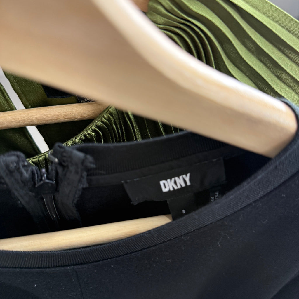 DKNY black dress with a rear zipper closure.