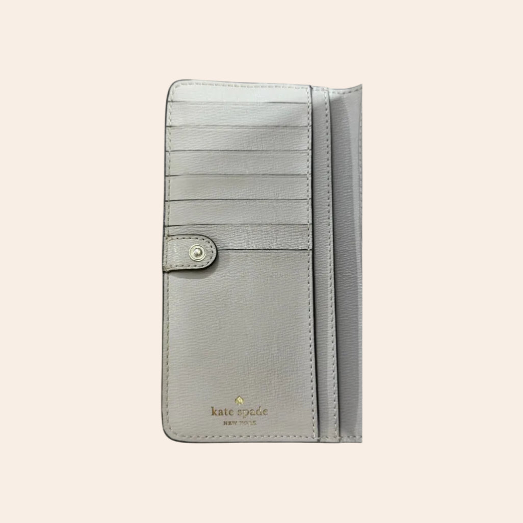 Kate Spade New York Large Slim Bifold Wallet in Pale Grey